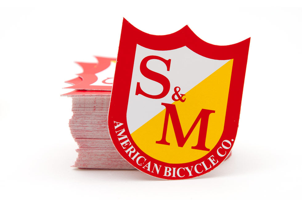 S&M RED SHIELD STICKER MEDIUM 6CM X 5CM