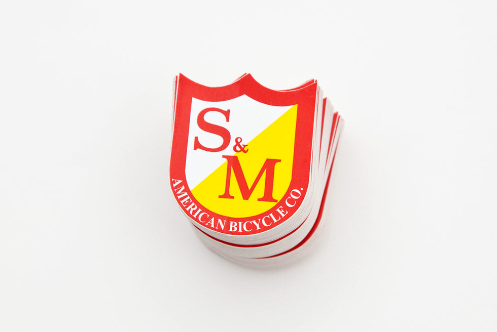 S&M RED SHIELD STICKER SMALL SIZE 38mm x 31mm